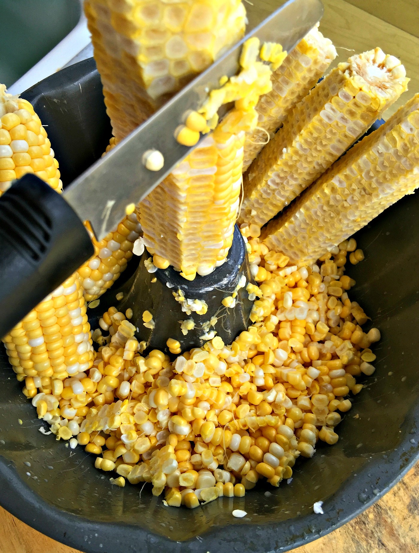 Cutting corn off the cob